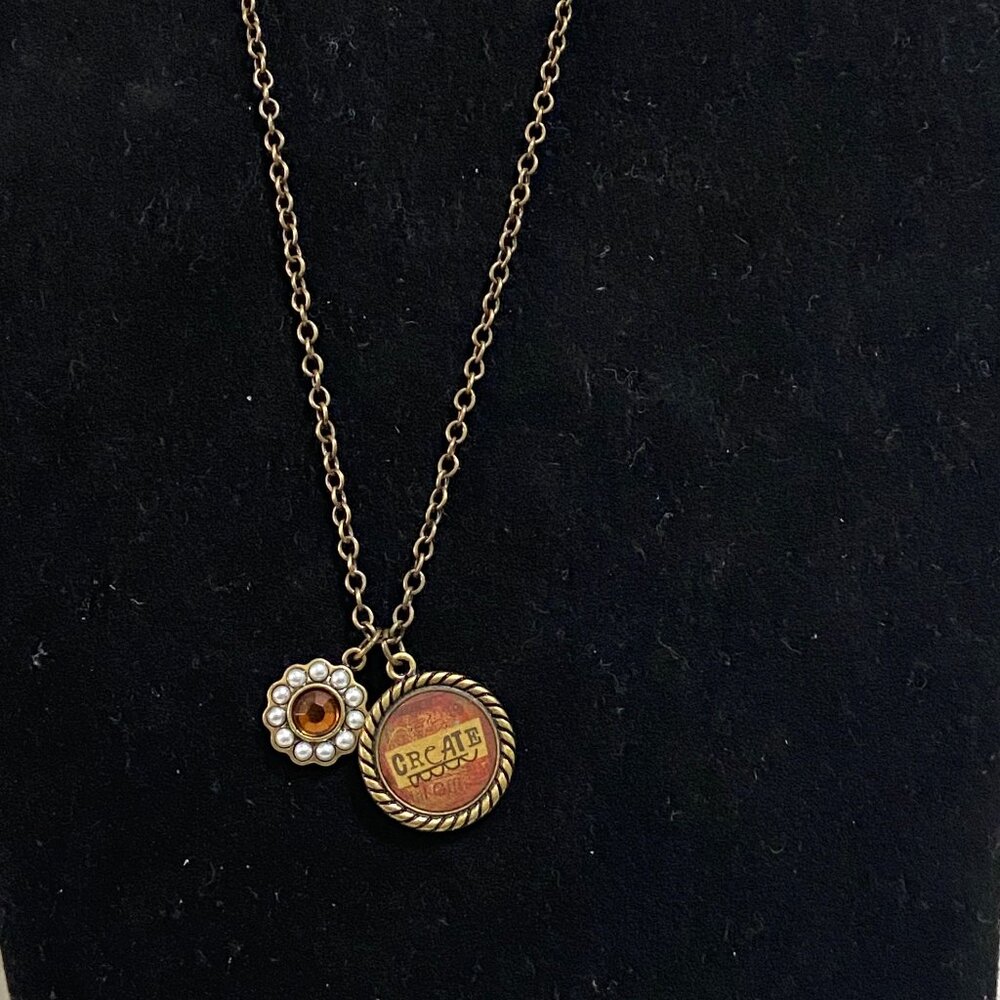 Kelly Rae Roberts 22" in length, brass-tone necklace with 2 charms